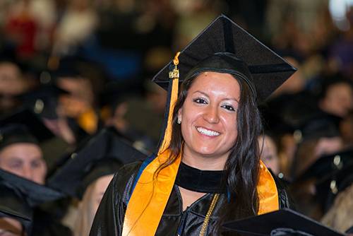 Graduate in cap and gown