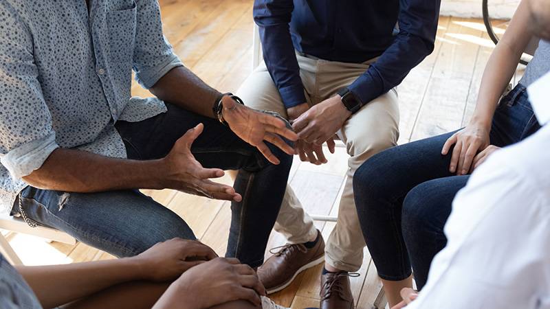 People sitting in a circle discussion