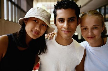 Three students smiling