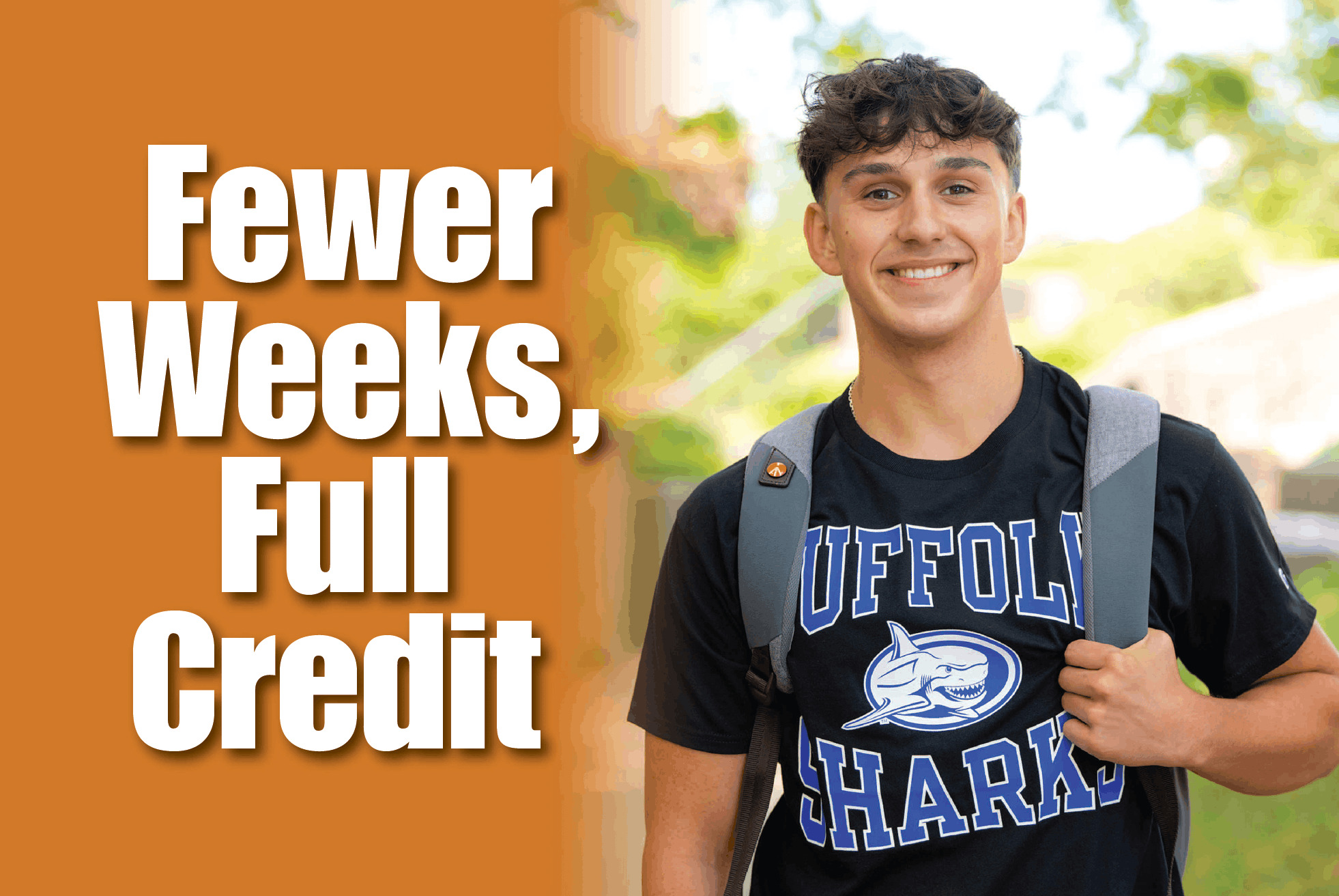 Few Weeks, Full Credit - A male student standing outside on campus wearing a Suffolk sweatshirt.