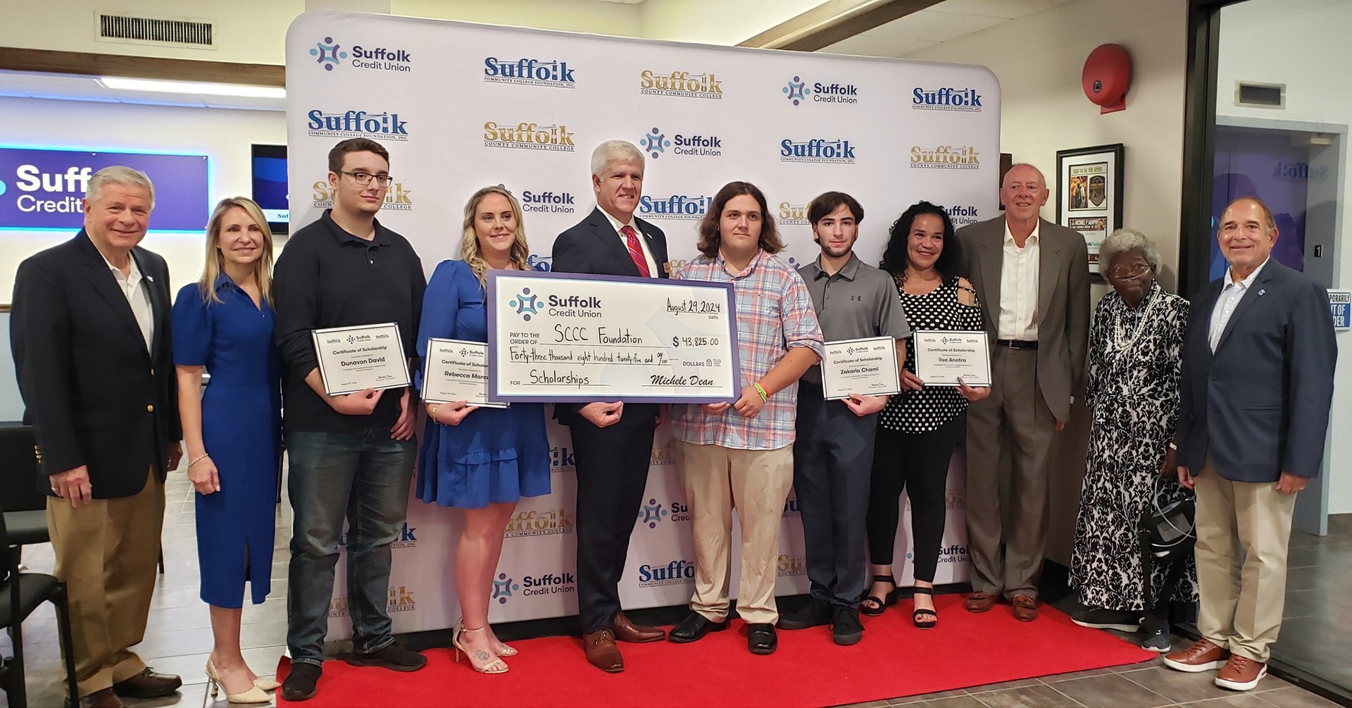 Scholarship awards ceremony showing students and Suffolk administrators