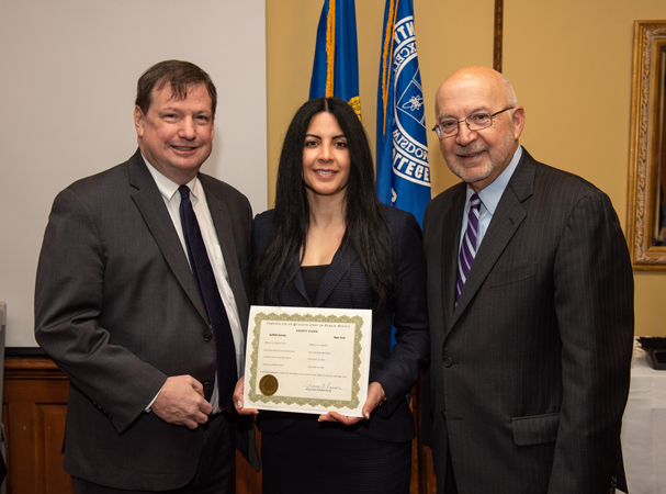 Priscilla Zarate has officially joined the Suffolk County Community College Board of Trustees and is welcomed by, at left, Board Chair E. Christopher Murray, and Interim College President Louis Petrizzo, at right.