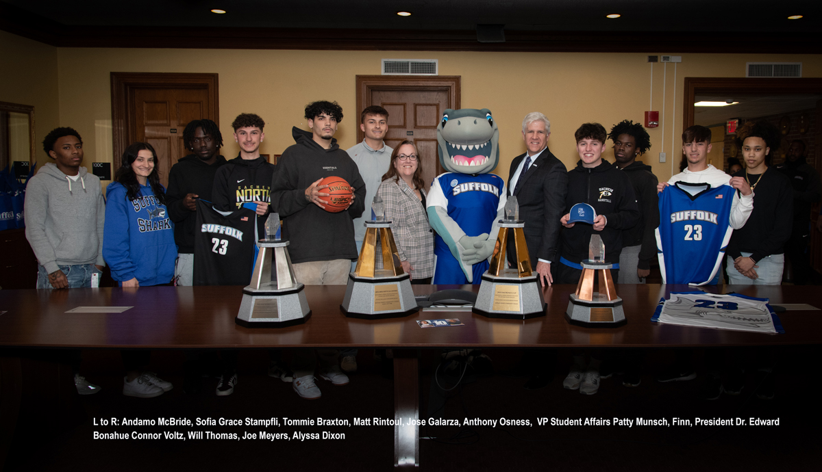 L to R: Andamo McBride, Sofia Grace Stampfli, Tommie Braxton, Matt Rintoul, Jose Galarza, Anthony Osness, VP Student Affairs Patty Munsch, Finn, President Dr. Edward Bonahue Connor Voltz, Will Thomas, Joe Meyers, Alyssa Dixon