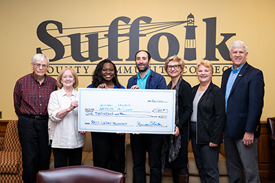 Photo Caption: (left to right): Peter Herron, Co-Chair, Retirees Association of Suffolk Community College Legacy Fellowship Grant Committee; Maureen Clinton, President, Retiree Association of Suffolk Community College; Natasha McCombs, Assistant Director of the Academic Success & Tutoring Center; Michael Levine, Instructor of Art; Donna Ciampa, Executive Dean and Chief Operating Officer of the Michael J. Grant Campus; Linda Sabatino, Co-Chair, Retirees Association of Suffolk Community College Legacy Fellowship Grant Committee; and Edward Bonahue, President, Suffolk County Community College. For a hi-res image, visit https://photos.app.goo.gl/Dks613HQWQHxwL9K6