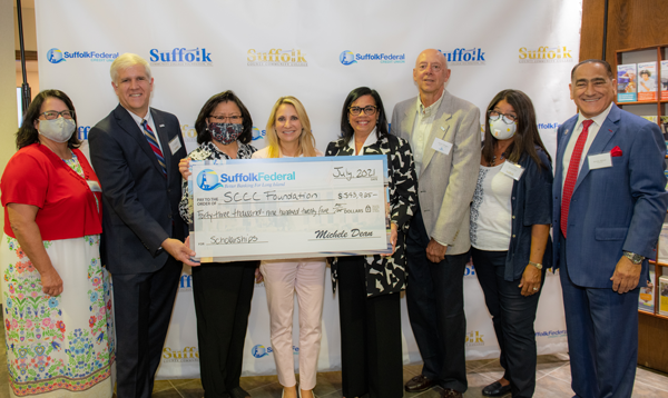 From left: Suffolk County Community College VP of Institutional Advancement Mary Lou Araneo; College President Dr. Edward Bonahue; College Board of Trustee member Belinda Pagdanganan; SFCU CEO Michele Dea; Chairwoman of the  Suffolk Community College Foundation Belinda Alvarez-Groneman; Jim Maggio, SFCU Board Chai; Dr. Sylvia Diaz, Suffolk Community College Foundation Executive Director; Steven Milner, Suffolk Community College Foundation Board of Directors