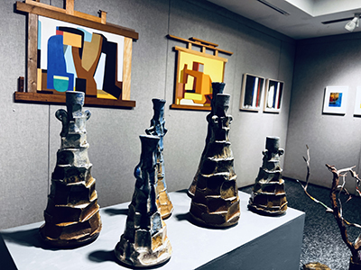 "Sandy Blue and Ash" and "Blue and Orange" (ceramic sculpture) by Puneeta Mittal from the 2025 Flecker Gallery Faculty Exhibition. For a hi-res image visit https://photos.app.goo.gl/Y2fNHdd8MGmz5BT99