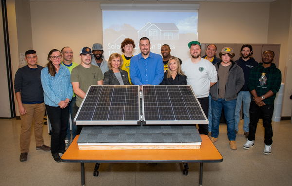 L to R: Christian Arevalo, Beverly Johnson, Christopher Duran, Andrew Lopez, DeShawn Little, Suffolk County Community College Executive Dean Donna Ciampa, Luke Shank, Instructor Brian Karp (VP at SUNation), Demarcus Frazier, Suffolk County Community College Assistant Director of Sustainability Melanie Morris-Carsch, Jokubas Balciunas , Gabriel Gomez, Nicolas Gomez, Jon -Tyler Glennon, Kwani Opharrow