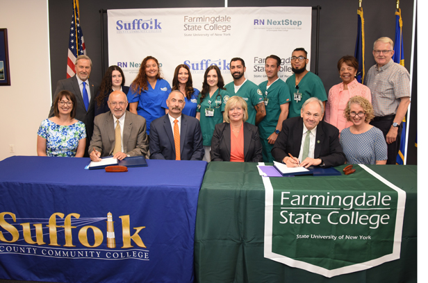 Nursing students, college officials and legislators cheered as The RN NextStep Joint Agreement between Suffolk County Community College and Farmingdale State College was signed. This important agreement provides a convenient and affordable upward mobility path for nursing students graduating with an Associate in Science (AS) degree in nursing from Suffolk County Community College.  Students admitted to Suffolk’s AS in nursing program are guaranteed admission into the FSC Online RN to BS Completion Program, provided they have completed their AS degree at Suffolk and pass their boards to become licensed Registered Nurses.